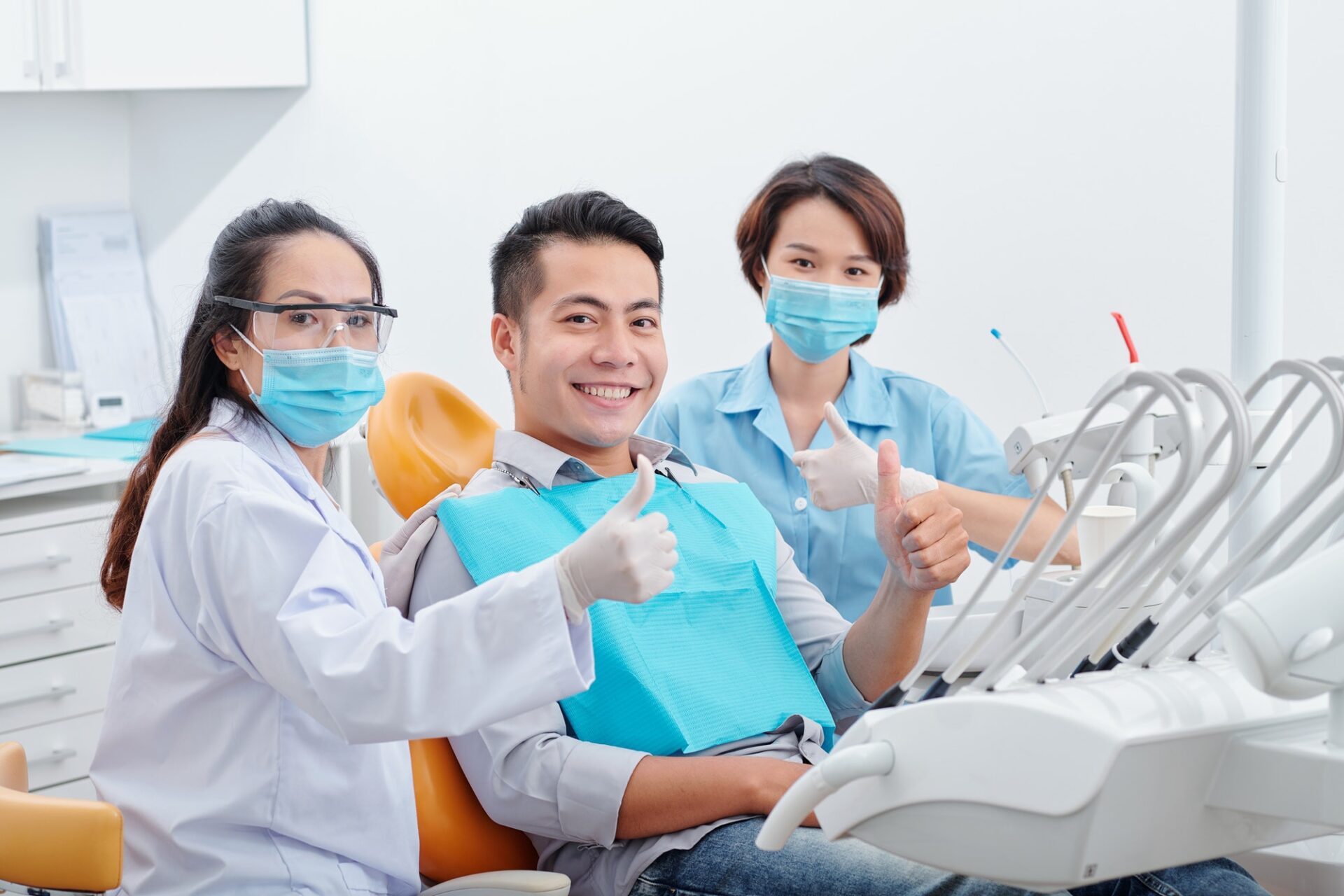 Happy Patient And Dentists