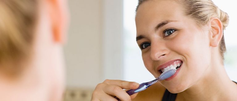 Woman Brushing Teeth